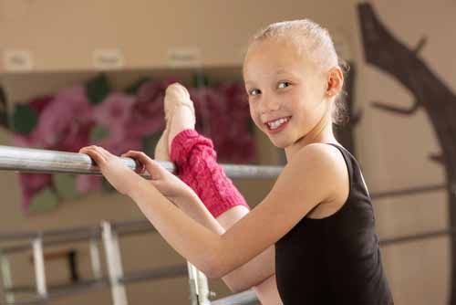 A girl stretches at a Florida Dance Studio